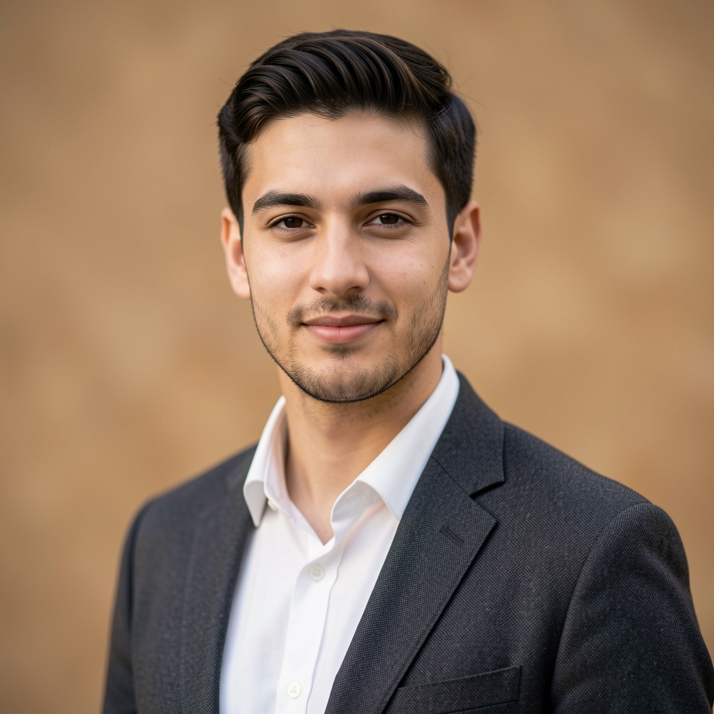 Portrait of Alistair Marsden, lead editor and writer at Olaven Review, photographed against a neutral warm-toned background in a Parisian editorial studio